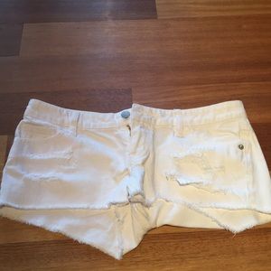 White ripped shorts